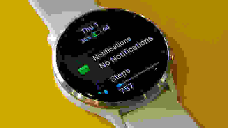 Garmin Venu 3 smartwatch with notifications and step tracker on watch face screen.