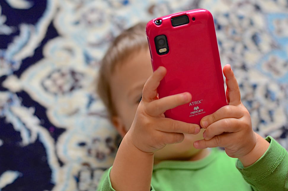 Toddler holding a smartphone