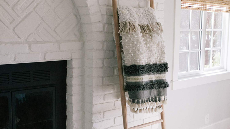 A blanket ladder to display throw blankets