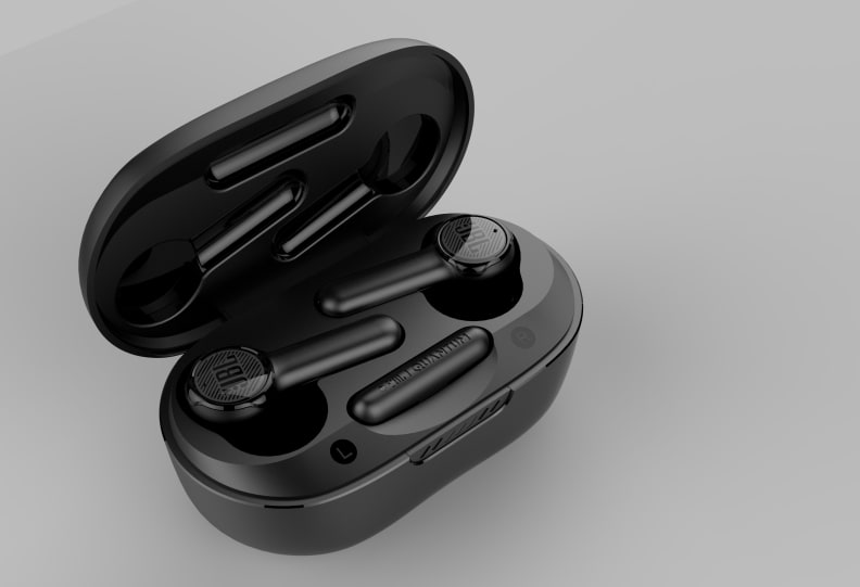 A pair of black, stick-style earbuds sit in an open black charging case with a grey background.