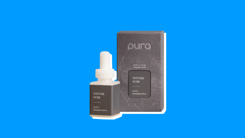 A Pura Fragrance Oil Refill box next to a refill container on a blue background.