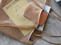 A beach bag being used to store items for a beach trip.