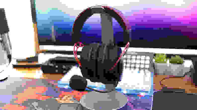 A full shot of a red and black gaming headset