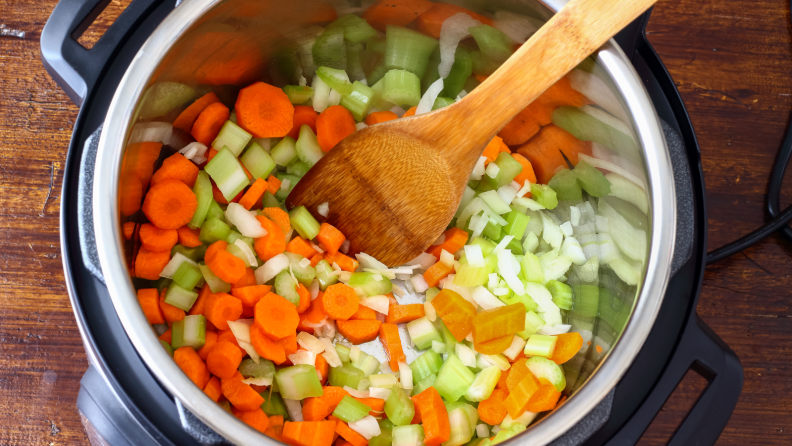 An above view of diced vegetables being cooked in an Instant Pot