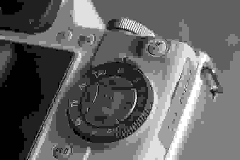 A photograph of the Pentax K-S1's mode dial and control cluster.