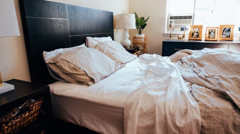 A bed with Brooklinen Luxe Core Sheet Set on it, among the best 30th birthday gift ideas.