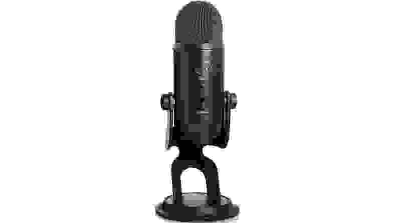 Studio microphone in stand on white background