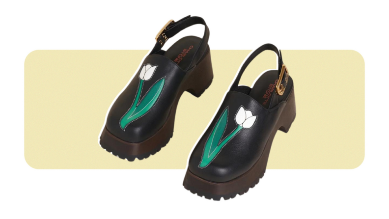 Leather clogs with an applique tulip flower detail.