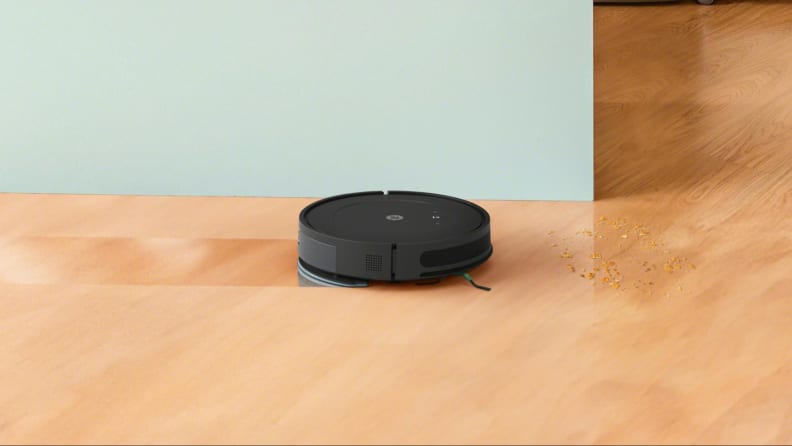 The iRobot Roomba Combo Essential mopping hardwood and vacuuming crumbs.