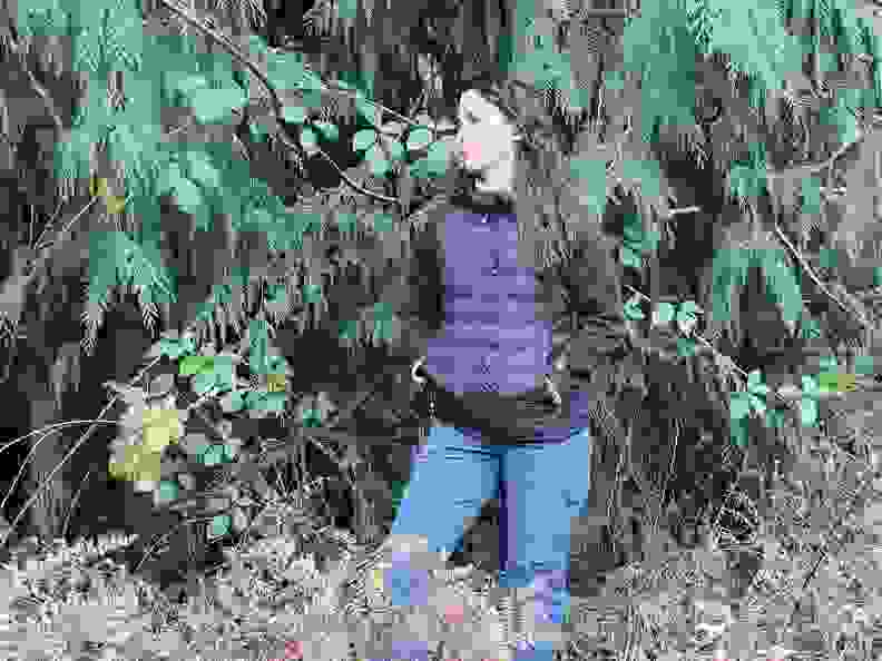 Woman in the forest wearing a COREEDGE vest