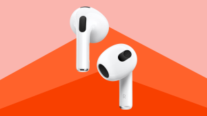 Close up of the newest Apple AirPods against a red background.