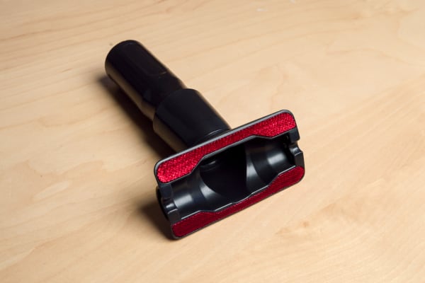 This tool will help you rout out crumbs on cushions.