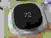 The Ecobee Smart Thermostat Premium is shown mounted on a board for testing.