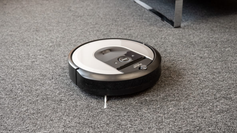 A robot vacuum cleans a floor.