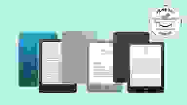 Amazon Kindles in front of a light green background