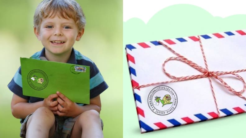 A young child joyfully holds a letter he just received.
