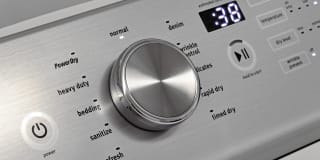 A close-up shot of a dryer's cycle selection dial.