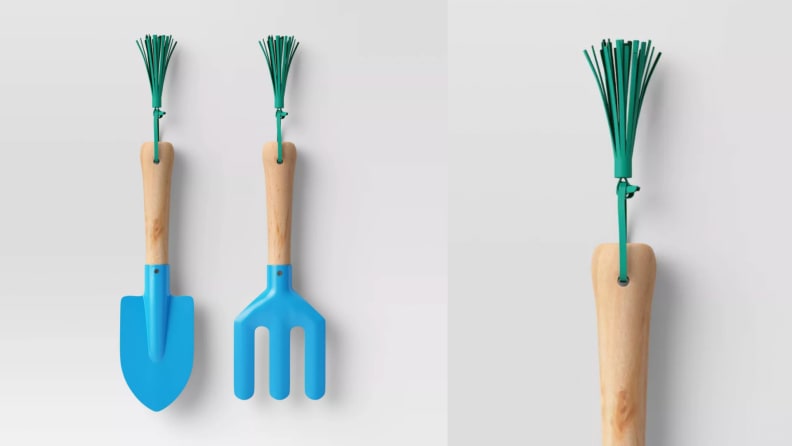 A set of children's gardening tools with a shovel and a cultivator.