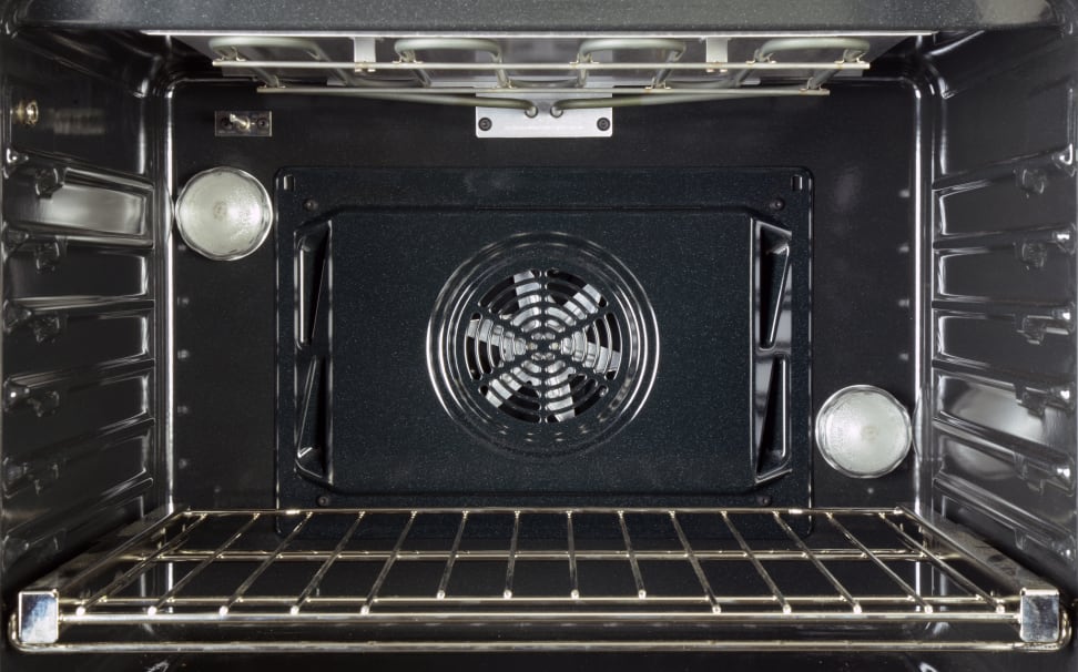 Convection oven cavity with fan in center.