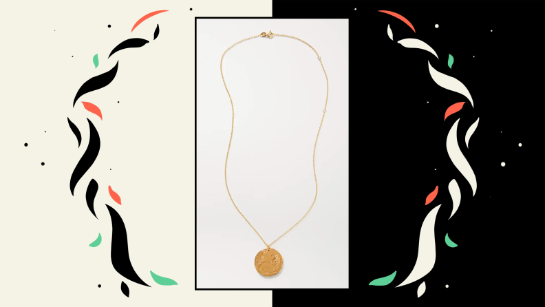 A gold necklace with a lion pendant.