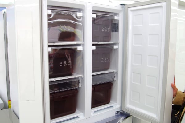 Inside an upright kimchi fridge.