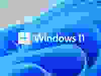 The windows 11 logo with blue waves in the background