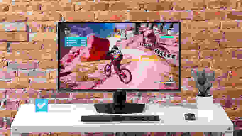 The MSI MPG 321URX computer monitor on a white desktop with a brick background.