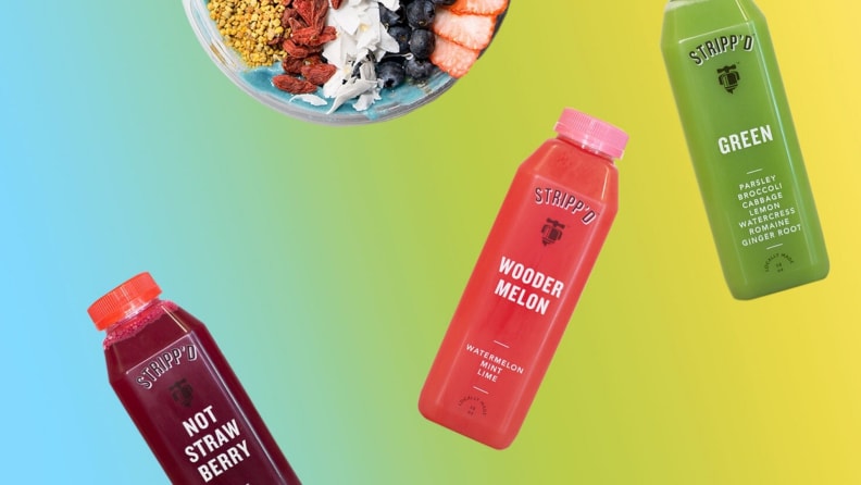 A blue to yellow gradient serves as the backdrop for three colorful bottles of cold-pressed juice from Philadelphia-based Stripp'd Juice.