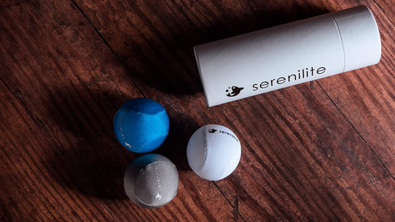 Three stress balls on a wooden surface