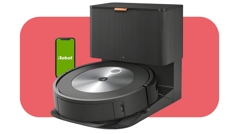 A  iRobot Roomba j7+ robot vacuum being held within charging doc.