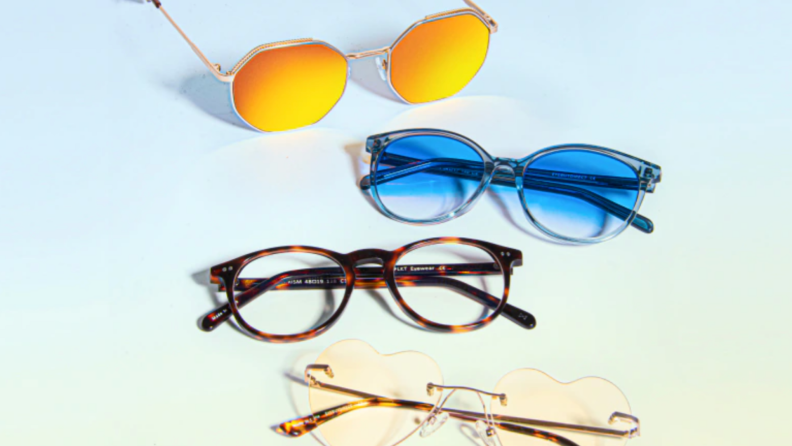 Four pairs of assorted sunglasses and eyeglasses