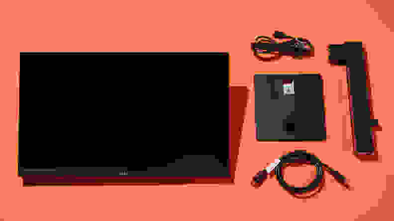 A monitor disassembled on an orange background