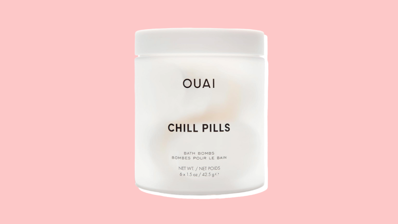 Ouai Chill Pills against a pink background.