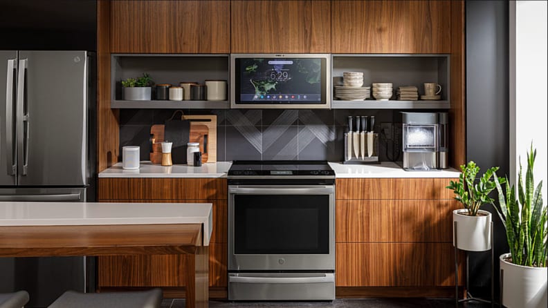 The GE Profile PHS93XYPFS in a modern kitchen surrounded by wooden cabinetry