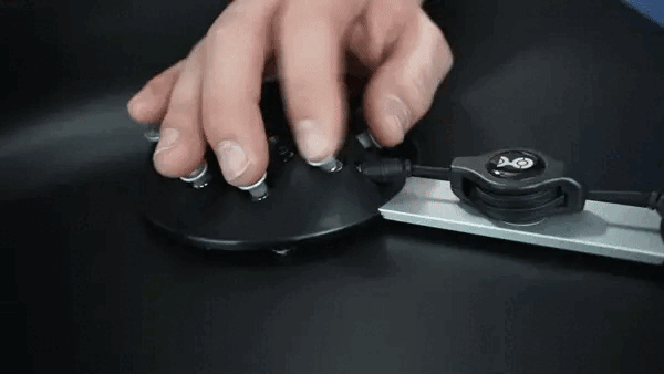 Person using single hand to operate the keys on the black Charachorder keyboard.