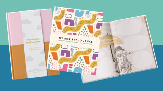 Product shots of mental health journals with multicolored covers.