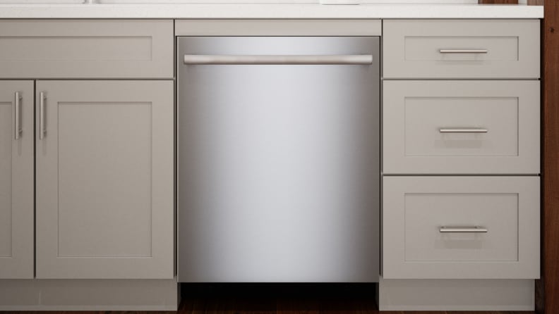 The Bosch 800 Series SGX78B55UC dishwasher installed into a set of modern kitchen cabinets.