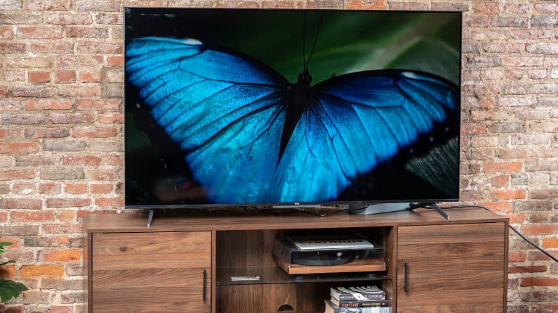 The TCL 5-Series with Google TV displaying 4K content in a living room setting