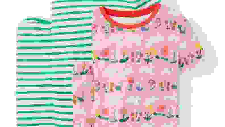 Two sets of pajamas. One in green stripes and one in a pink with an Easter bunny theme.