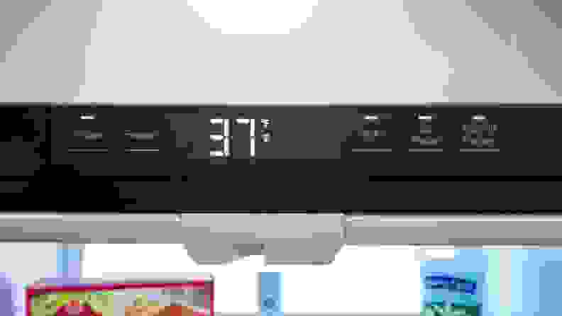 A close-up of the fridge's temperature display, centered along the top edge of the refrigerator compartment.