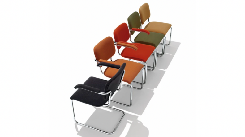 Row of Cesca chairs with upholstery in black, orange, red, green, and ten.