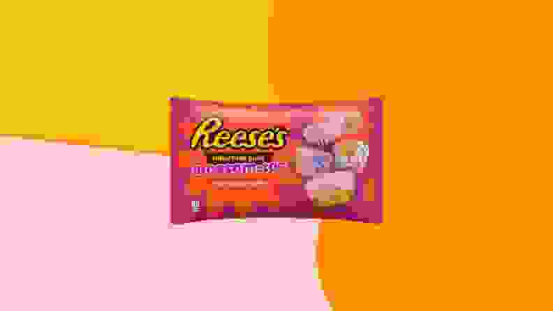 Reese's Blossom Top mini cup packaging on an orange, yellow, and pink background