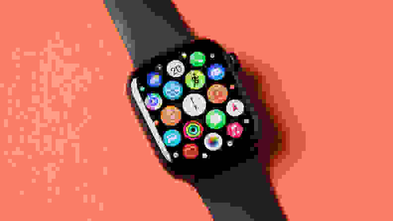 An Apple Watch Series 8 with its app interface open, sits on an orange background.
