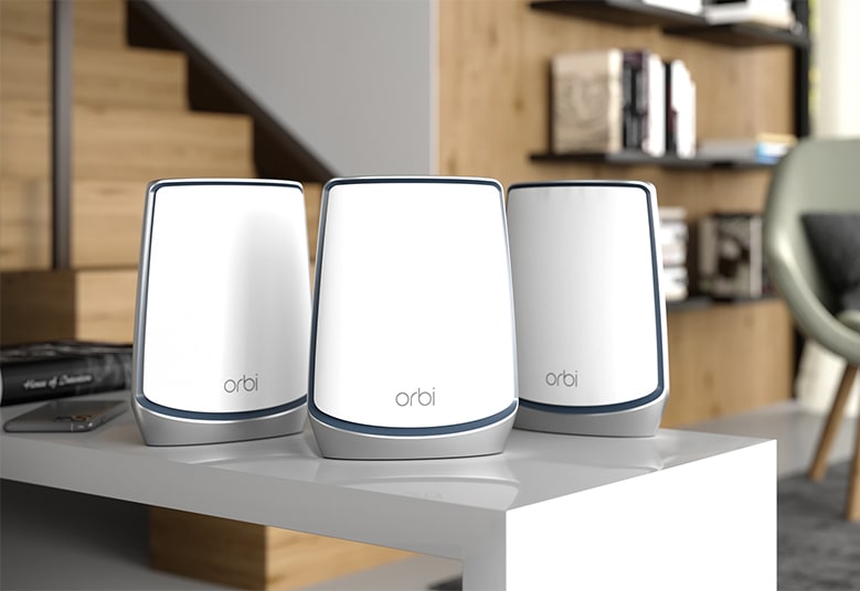 Three wi-fi networking devices on top of a counter