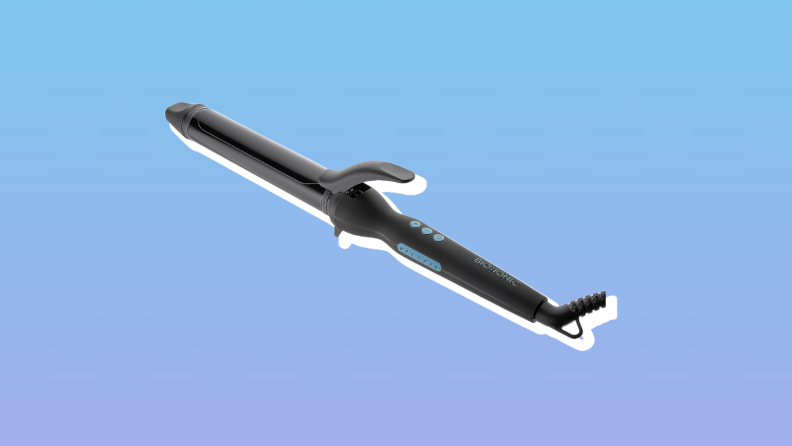 Bio Ionic curling iron against a blue background.