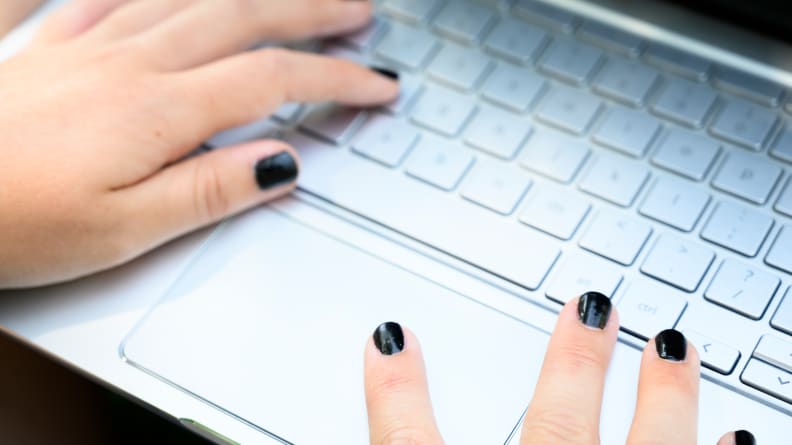 A person typing on the Asus Chromebook C434TA