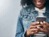 Woman holding mobile phone