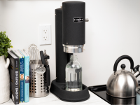 The Aarke Carbonator Pro sits on a kitchen counter.