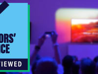 CES Editors' Choice badge on background of man taking picture of a television