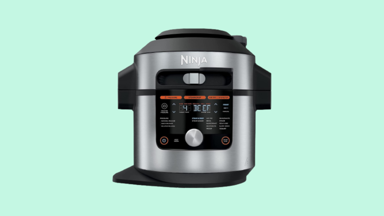 Pressure cooker against blue background